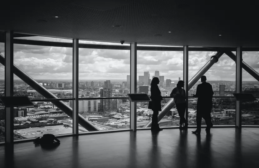 Silhouettes in office window