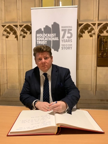 Dean signs book on Holocaust Memorial Day