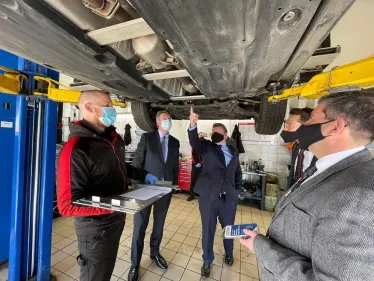 Dean Russell takes a look at the underside of a car