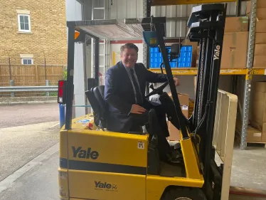 Dean Russell in a forklift